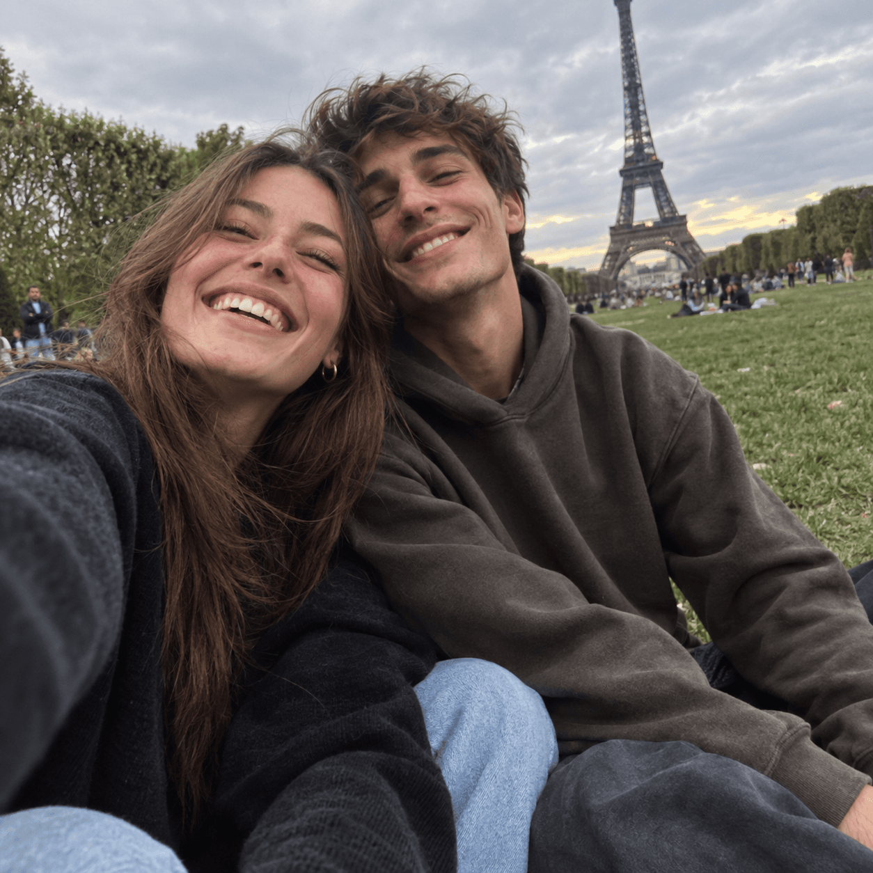 Young couple selfie on the grass at Champ de Mars