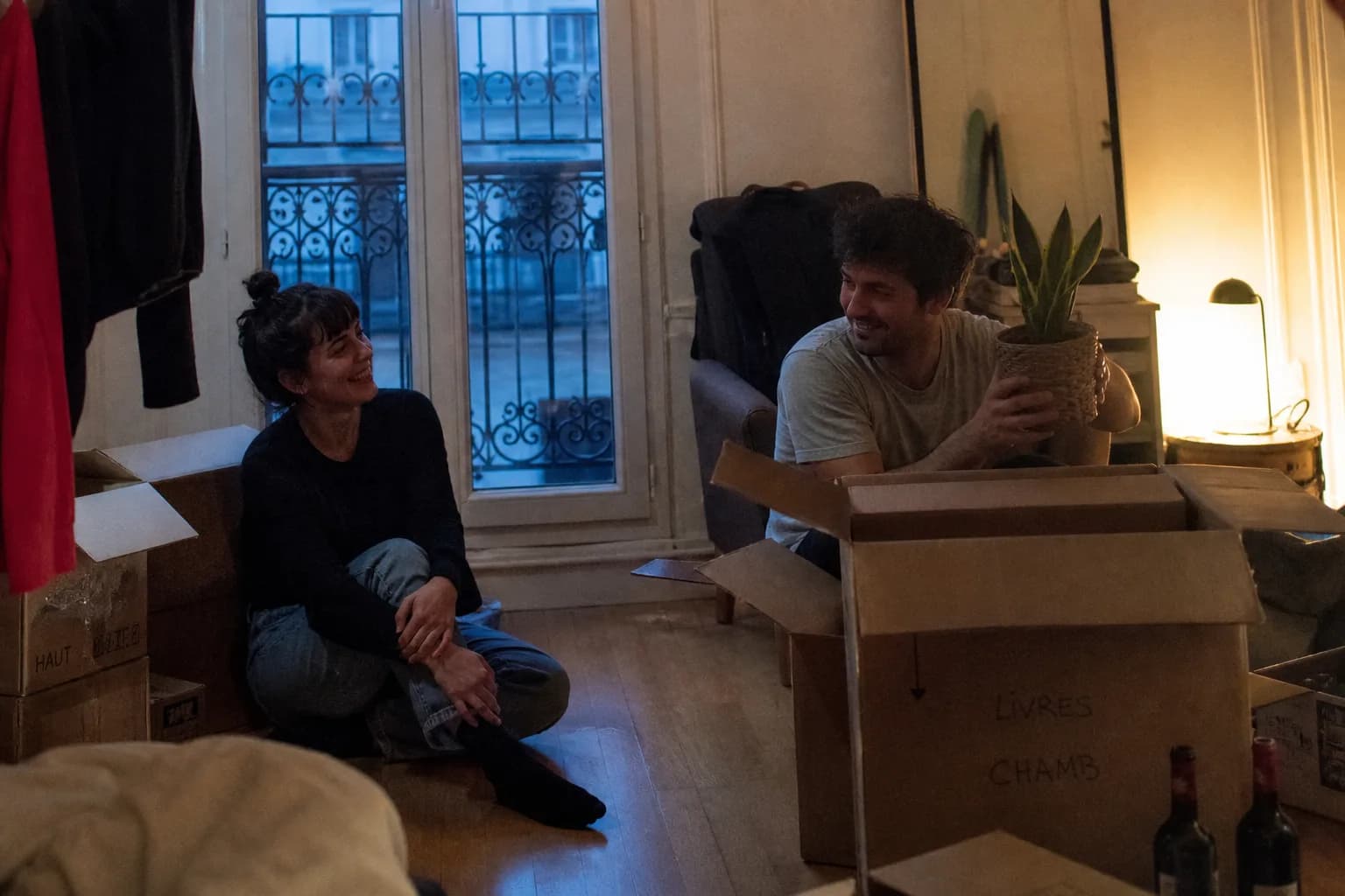 A couple unpacking in their new apartment